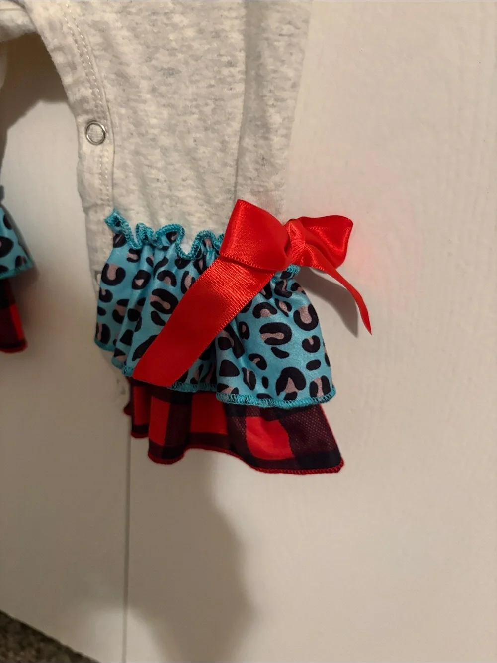 Ho Ho Christmas Ruffle One-Piece Romper - Light Gray with Red & Blue Accents
